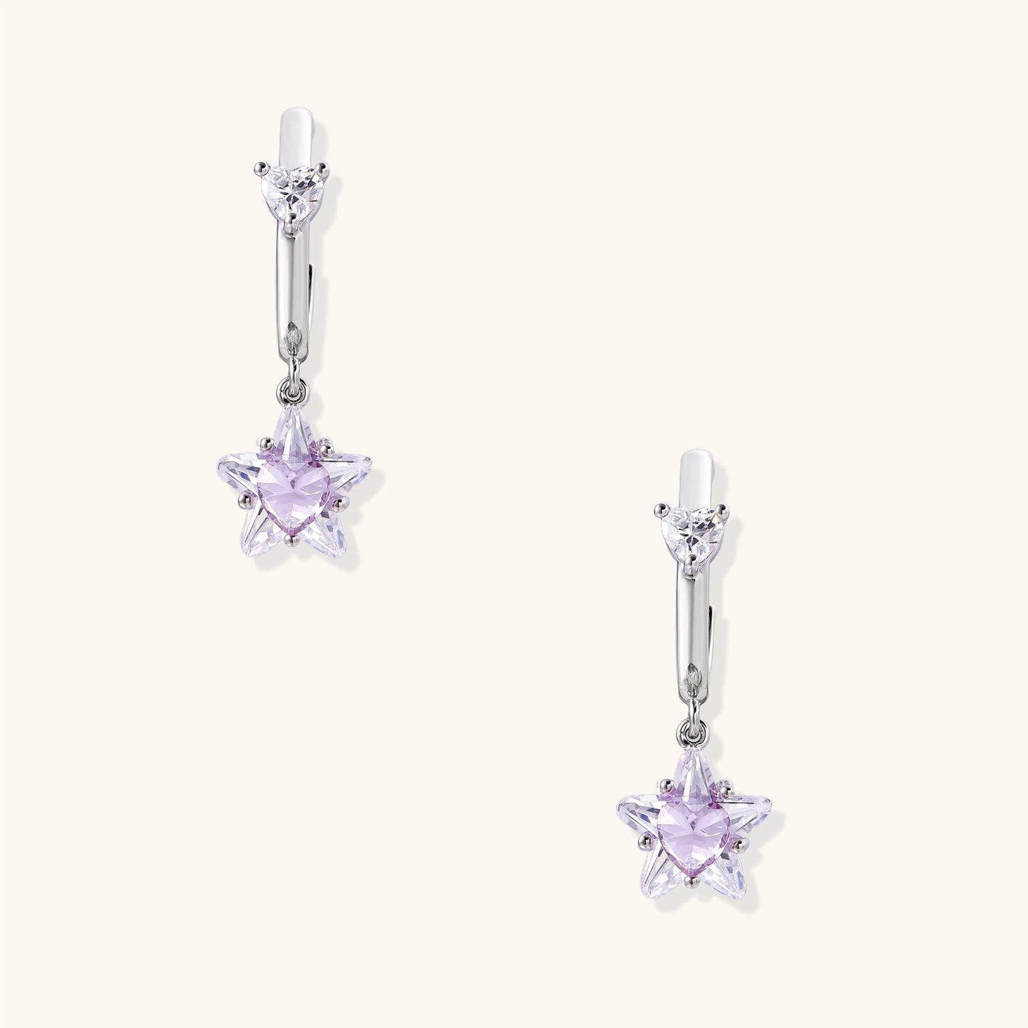 Drop earrings with purple star-shaped zirconia stones and clear teardrop accents in gold-plated brass setting