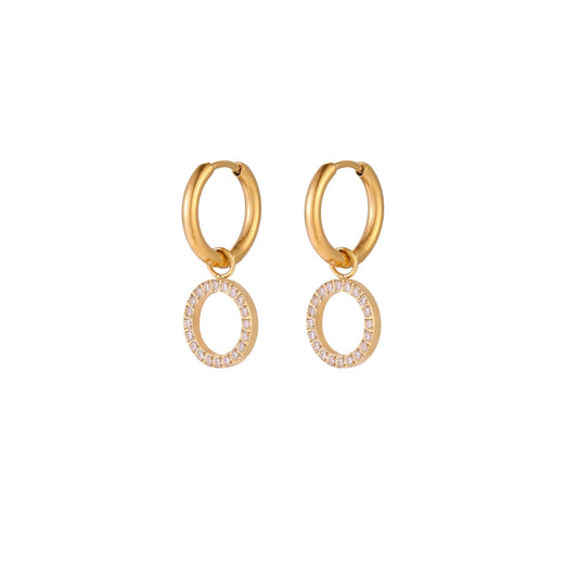 Gold-plated huggie hoop earrings with CZ-studded open circle charms on beige background