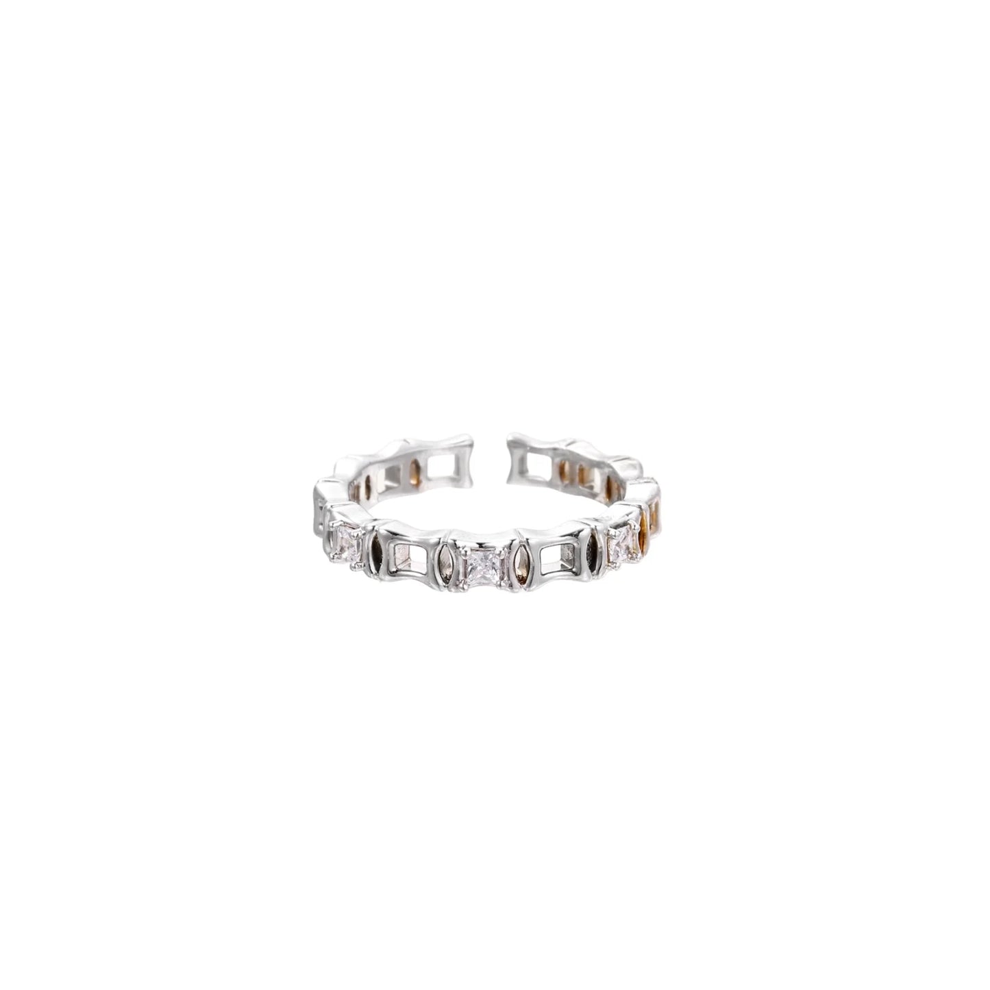 White gold plated ring with architectural lattice design and zirconia accents on cream background