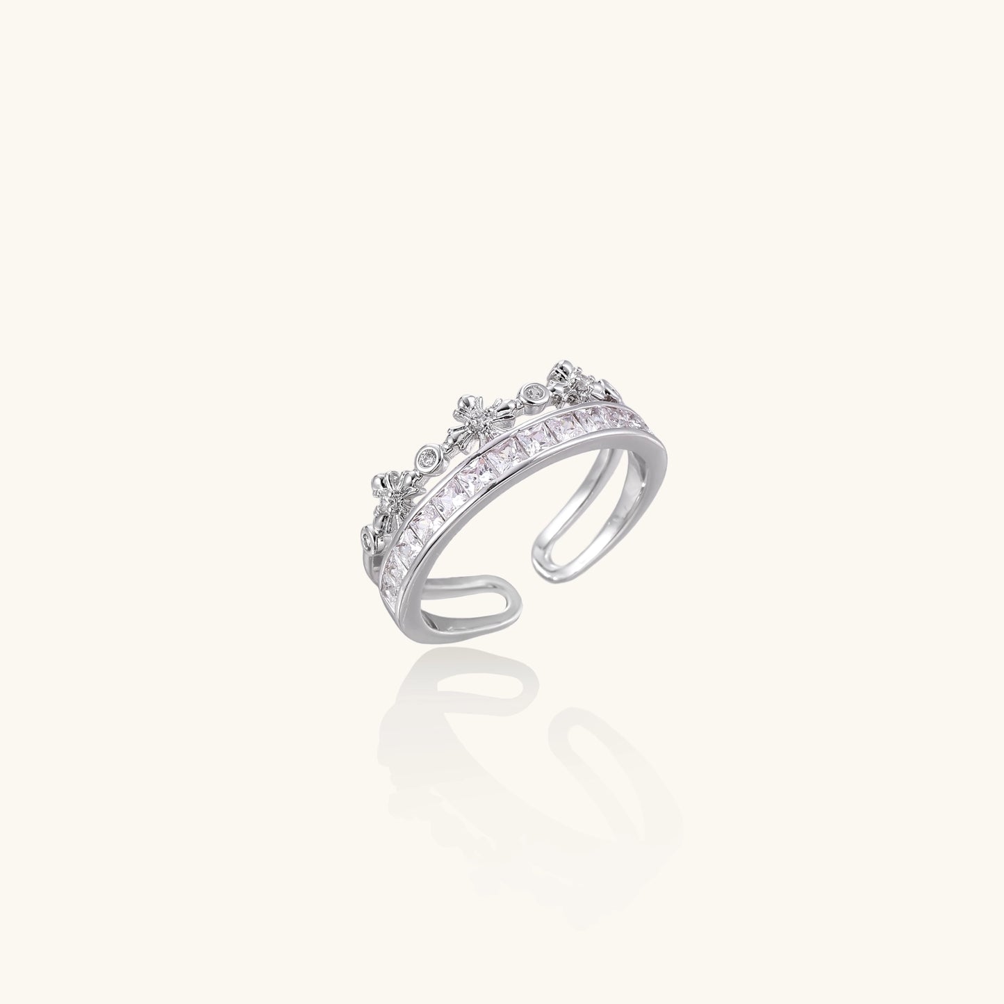Adjustable gold-plated crown ring with zirconia crystals in ornate tiara design on white background.