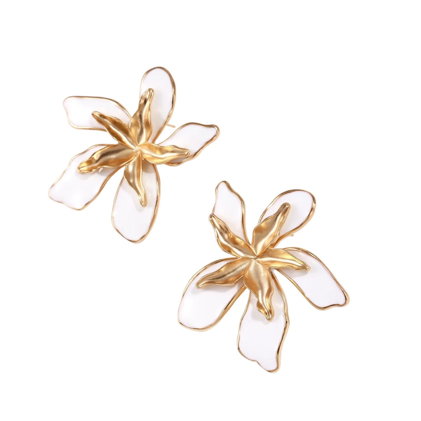 White enamel tropical flower earrings with sculptural gold-plated center and organic petal design on cream background