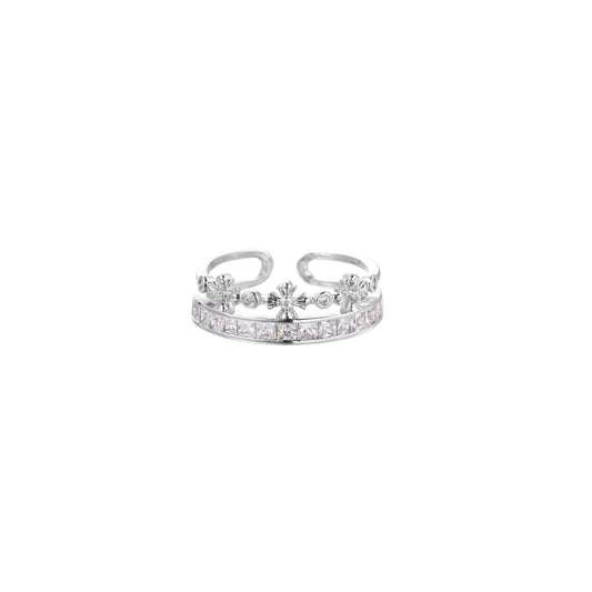 Silver-toned adjustable crown ring with channel-set square zirconia stones and delicate floral details on white background