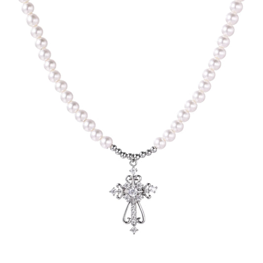 White pearl beaded necklace with ornate crystal-embellished cross pendant on white background, white gold plated finish
