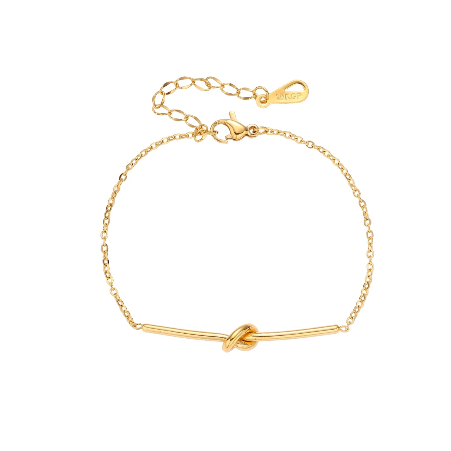 Delicate gold chain bracelet with minimalist bar and centered knot detail on cream background