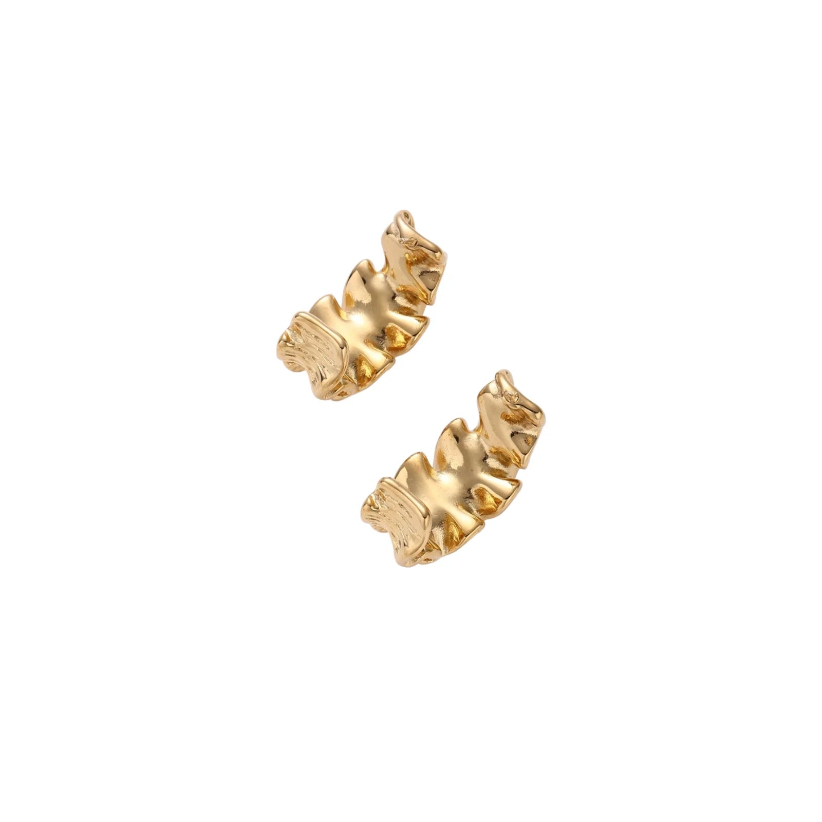Pair of gold huggie hoops with sculpted wave texture and dimensional ripples on neutral background.