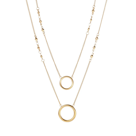 Layered gold necklace set with two open circle pendants and mixed chain styles on beige background